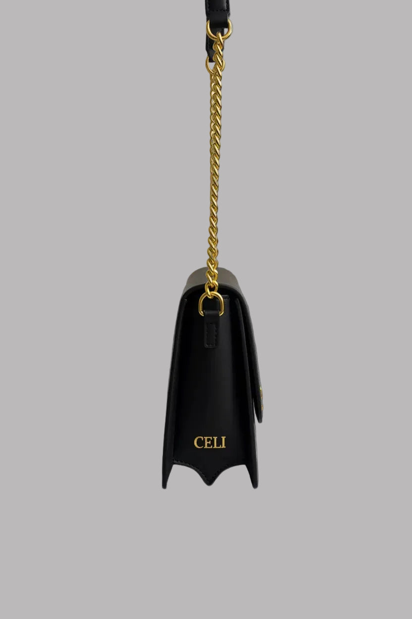 CELI Signature Shoulder Bag worn as a luxury statement bag